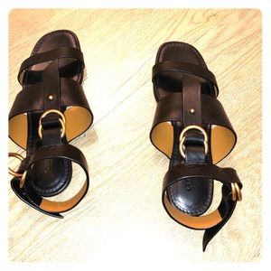 Chloé black flat sandals ankle wrap gold accents